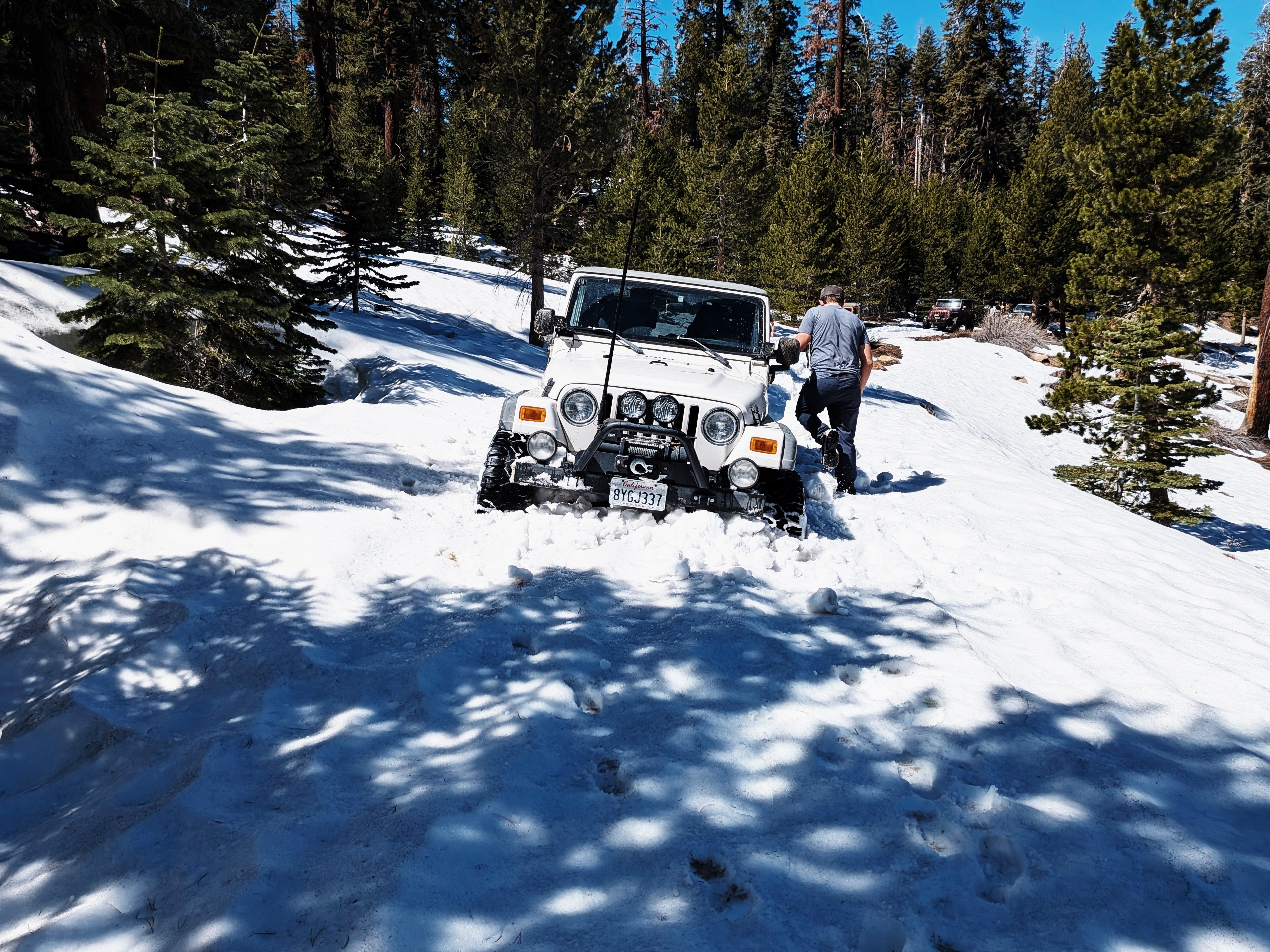 Jeep Wrangler stuck in deep snow while winching