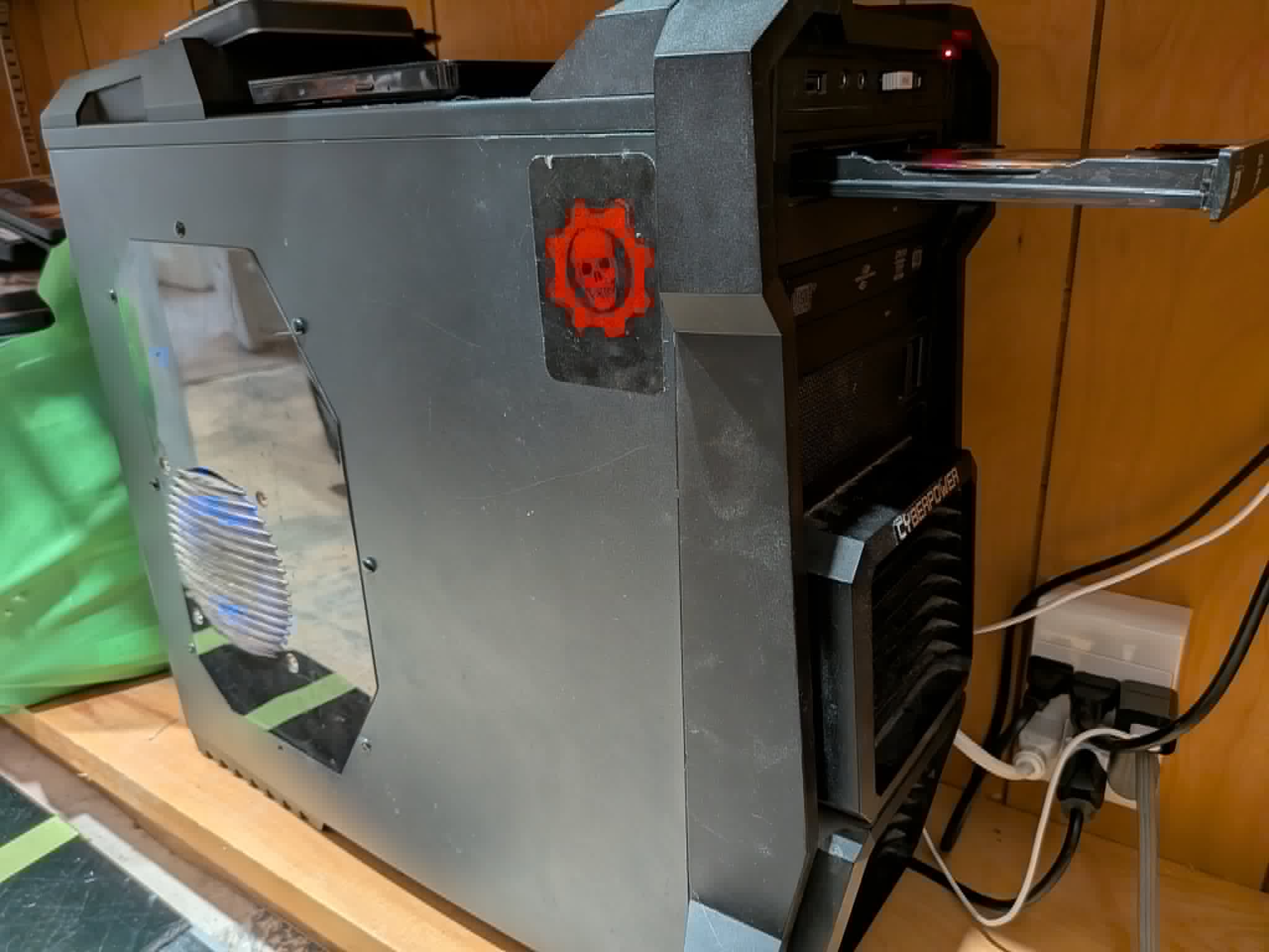 Front and side view of the automated ripping server with an optical drive tray open